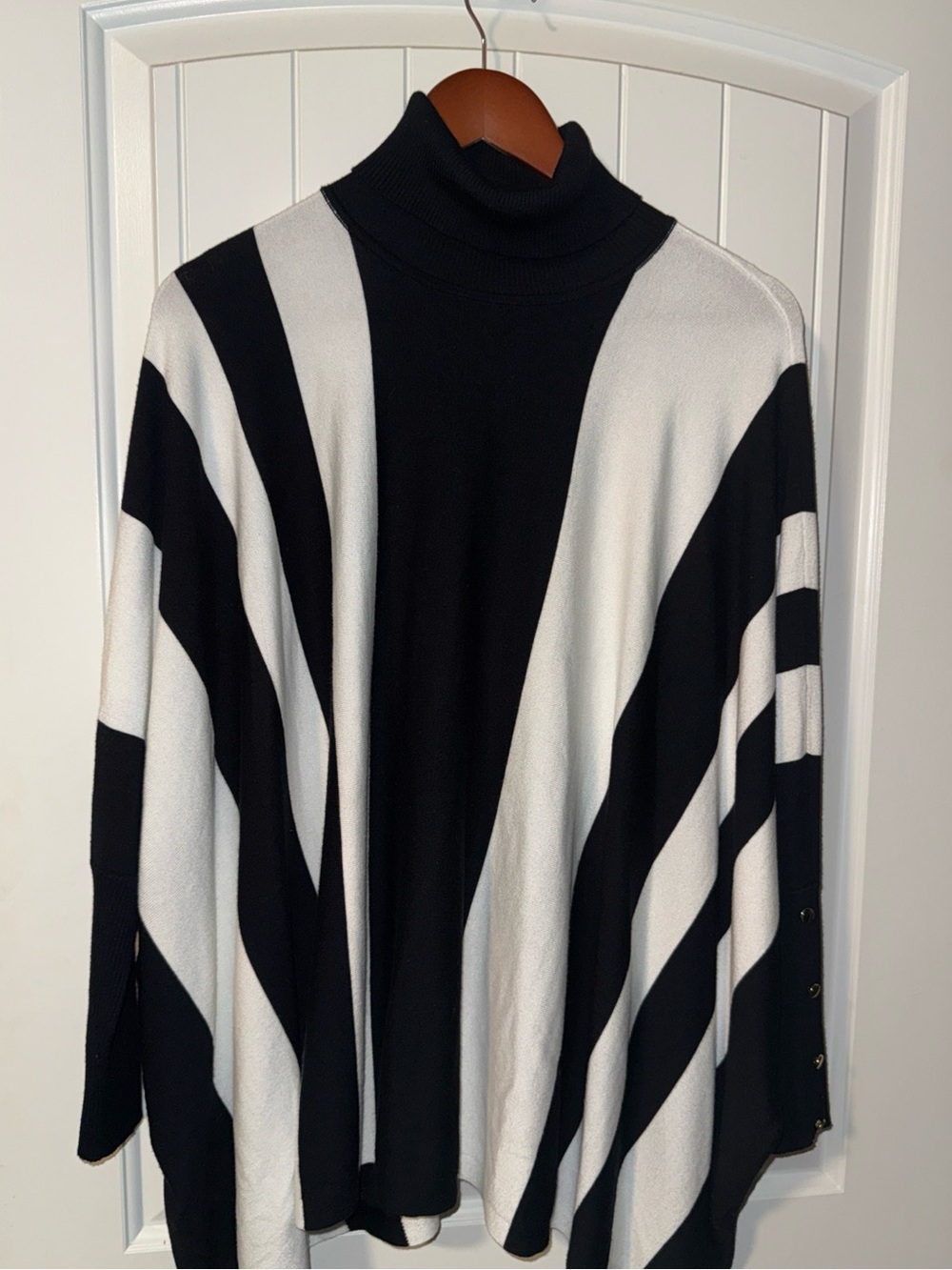 Woman Within Black & White Striped Turtleneck Poncho